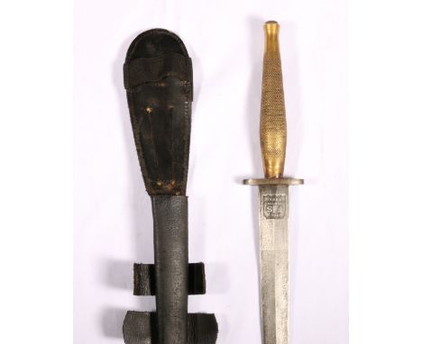 British Fairbairn-Sykes FS fighting knife with tooled brass grip complete with sheath CONDITION REPORT: Wear to the handle
Bl