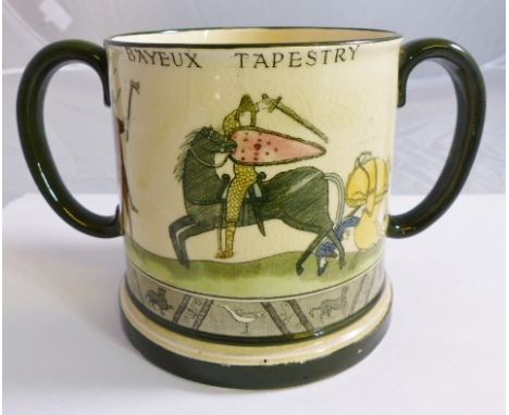 DOULTON BAYEUX TAPESTRY LOVING CUP. Royal Doulton twin handled tankard depicting Battle Of Hastings scene D2873, H ~ 10cm