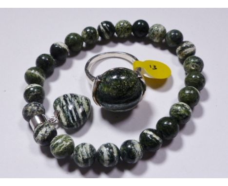SILVER RING AND BRACELET SET. Sterling silver Russian serpentine ring and bracelet set