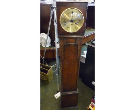 GRANDDAUGHTER CLOCK. Free standing longcase Granddaughter clock with gold coloured face and Roman numeral chapter ring, H ~ 1