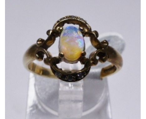 9CT GOLD OPAL RING. 9ct gold opal and diamond ring, size N/O