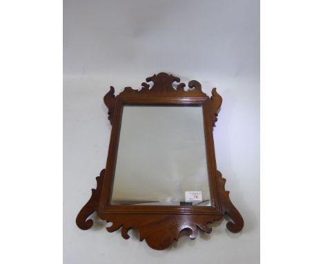 A Mahogany Carved Wall Mirror, approx 36 x 53 cms. (wf)