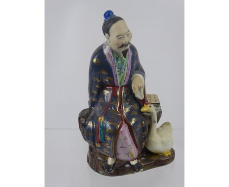 A Chinese Figure of a Man, together with a set of six enamel teaspoons.