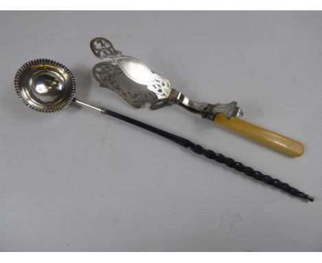 An Antique Brandy Ladle, with ebony twist handle, a silver plated cake tongs. (2)