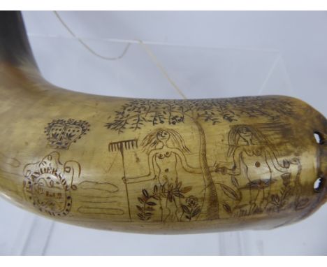 An Antique Bovine Horn Flask, engraved with Adam and Eve, with family motto Anderson, approx 37 cms long.