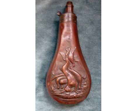 An Antique Copper Powder Flask, decorated with hares and pheasants, three position adjustable nozzle.