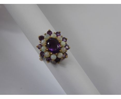 A Lady's 9 ct Amethyst and Opal Ring, the centre amethyst 9 x 7mm, 10 x 3mm amethysts and 10 x 3mm opals, size L, approx 4.1 