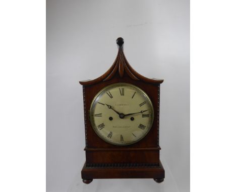 A Chiming Mahogany Cased Mantle Clock by Lashmore, Southampton, the clock having a Dutch style slope top with carved corners 