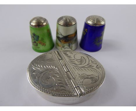 Three Fine Silver and Enamel Thimbles, floral design on ivory, cobalt and green ground together with a silver hinged snuff bo