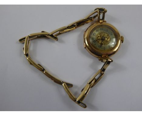 A Lady's 9 ct (375) Cocktail Watch, engine turned face on rolled gold bracelet, 13714 stamp, in the original box.