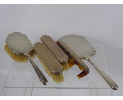 A Solid Silver Dressing Table Set, including two clothes brushes, hair brush, mirror and comb, together with another hair bru