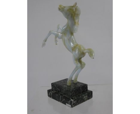 Istvan Komaromy Glass Figure of a Foal, raised on a green marble plinth bearing label, to lower right. Note: Istvan Komaromy 