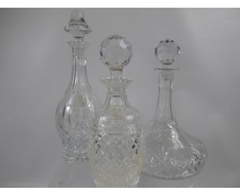 Three Cut Glass Decanters, including wine and ship's decanter. (3)