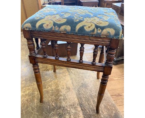 A Late Victorian Music Stool. With upholstered seat. 