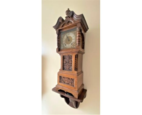 A Miniature Longcase Clock on bracket. 