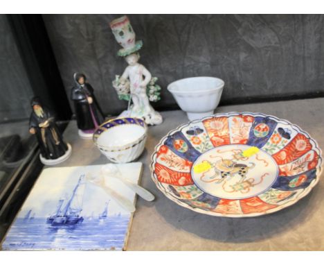 An Arita Dish with wavy rim 21.5cm diameter, a cherub candlestick, Delft tile and other items (9) 