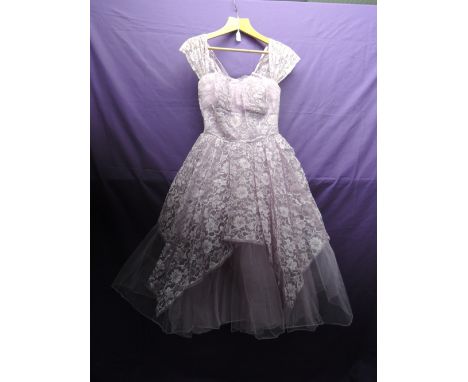 Vintage 1950s lilac and silver gown having layers of tulle over an integrated underskirt. Back metal zip.good condition with 