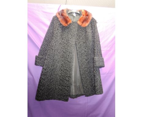 A vintage 1960s astrakhan coat having mink collar and pockets to sides,fully lined, great condition.
Condition Report Top woo