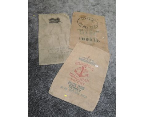 Three vintage advertising sacks. One postal and the other two flour or similar.