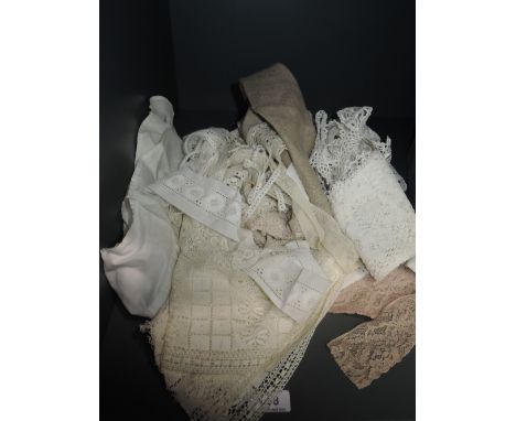 An assortment of vintage lace and crochet work perfect for projects or crafts