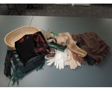A basket of mixed vintage items, shawls, gloves and belts and fur items including a hat two tippets and a stole.good conditio