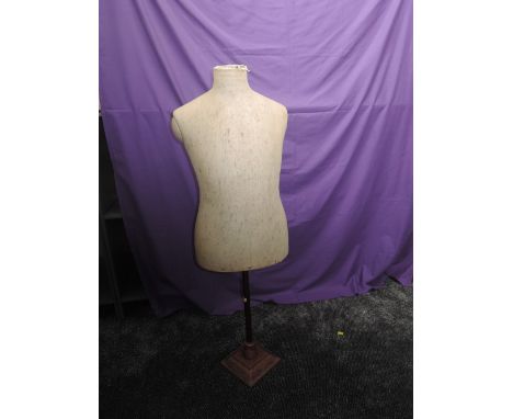 A vintage fabric covered tailors dummy, having wood frame and base. Stamp to under side reading 'Sage, London', great conditi