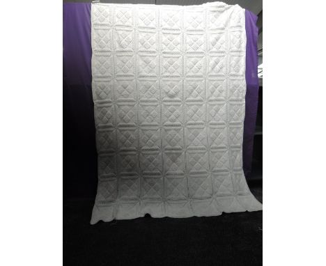 A large vintage knitted white bed covering, intricate detailing throughout. believed by vendor to be around 1930s. Lovely con