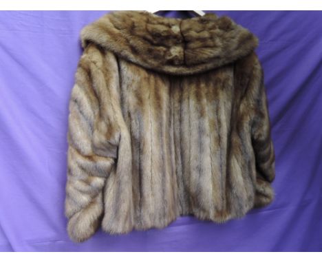 A vintage 1950s short caramel coloured mink jacket, fully lined and in wonderful condition.
CONDITION REPORT.
Around a size 1