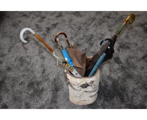 A selection of vintage umbrellas with Lucite or similar in silver birch umbrella stand. Good condition.