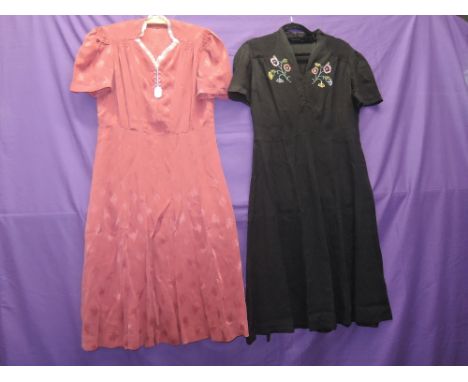 Two vintage dresses, one in pomegranate crepe having been a wedding dress in 1941, the other in black,with embroidery to bodi