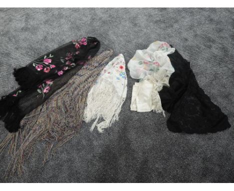 An interesting lot of antique and vintage fringed shawls, lace collars and a scarf, good condition
Condition Report All good 