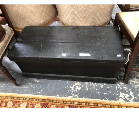 A BLACK PAINTED WOODEN TRUNK. W 94 x D 41 x H 36cms.