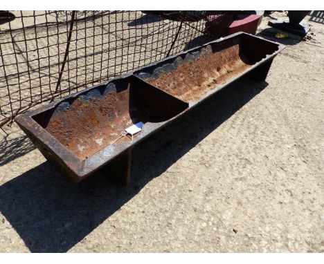 A SMALL CAST IRON TROUGH