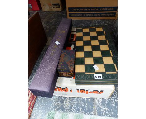 A WOODEN CHESS SET IN A FOLDING BOARD, A CHINESE SCROLL, BOXED PAIR OF BALLS AND A BOXED SET OF ARNOLDS SOLID SHAPES OR BUILD