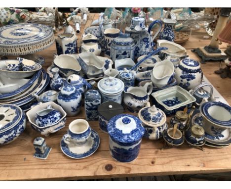 A LARGE COLLECTION OF BLUE AND WHITE WARES TO INCLUDE IRON STONE, SPODE, GIBSON AND SONS, POWELL - CRAFT, EASTERN EXAMPLES ET