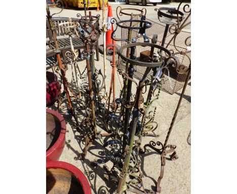 A QUANTITY OF ANTIQUE WROUGHT IRON LAMP STANDS