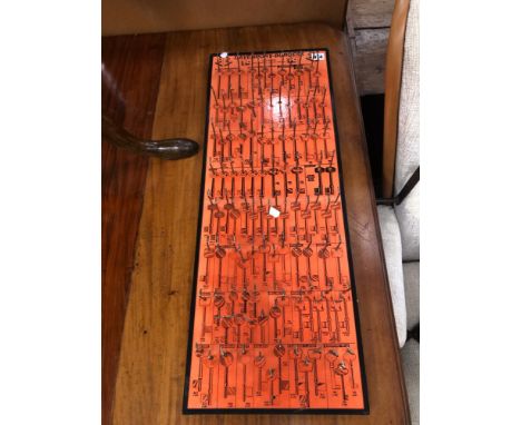 A VINTAGE DAVENPORT-BURGESS KEY DISPLAY PLAQUE.