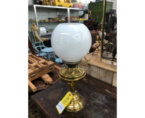 A BRASS OIL LAMP WITH OPAQUE WHITE SHADE
