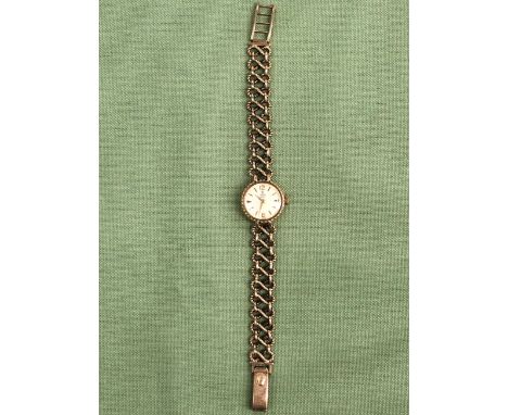 A LADIES 9ct GOLD TUDOR BRACELET WATCH THE LADDER CLASP STAMPED ROLEX WITH A ROLEX LOGO, GROSS WEIGHT 22.3grms. 