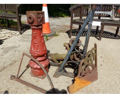 A CAST IRON LAMP POST BASE, TWO PUMPS AND VARIOUS IRON WARES.