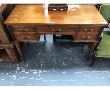 A 20th C. MAHOGANY TABLE WITH A CONFIGURATION OF FIVE DRAWERS, THE SQUARE LEGS TAPERING TO CERAMIC CASTER FEET. W 122 x D 56 