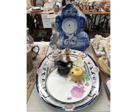 A LARGE BLUE AND WHITE PORCELAIN BLUE AND WHITE MANTEL CLOCK DECORATED WITH FEMALE FIGURES TOGETHER WITH A NAO LAMP BASE, A H