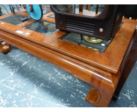 A MODERN CHINESE GLAZED HARD WOOD COFFEE TABLE, THE TOP WITH SIX BEVELLED GLASS PANELS ABOVE SCROLL LEGS. W 129 x D 75 x H 38