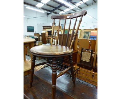 A MAHOGANY CIRCULAR SEATED STICK BACKED CHAIR