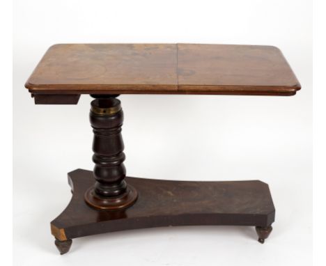 A Regency bed table with reading slope drawer and raised on adjustable column and flat tripod support, 94cm wide
