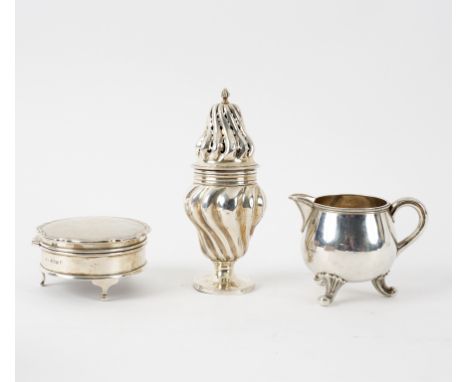 A Victorian silver caster, WC, London 1891 of spirally ribbed form, 13cm high, a trinket box with engine turned cover on thre