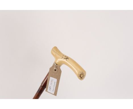 A Japanese bamboo walking stick, the ivory handle carved beetles Condition Report: This lot contains an element of pre-1947 i