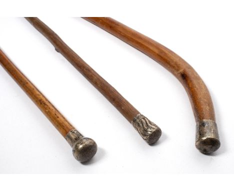 A malacca walking stick with silver knop, London 1918 and two others Condition Report: This lot contains an element of pre-19