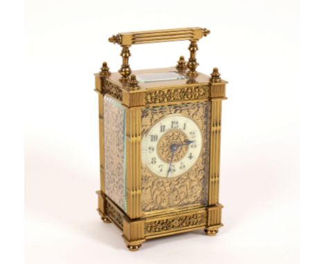 A gilt-brass eight-day carriage clock with pierced, chased and engraved surround, 16.5cm high