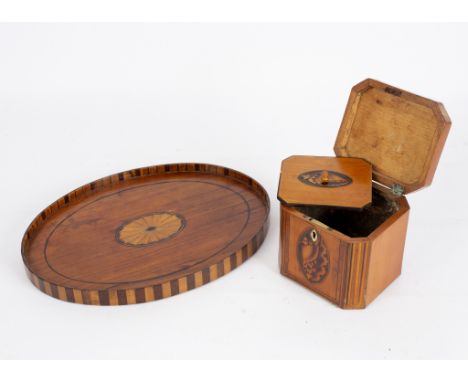 A George III satinwood and inlaid tea caddy of canted rectangular form, the top and front inlaid shell paterae, 12cm wide and